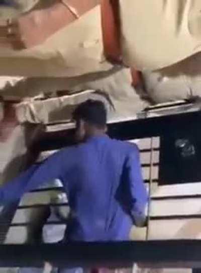 Rearrested Prisoner Demonstrates How He Escaped From His Locked Cell To Police Officers