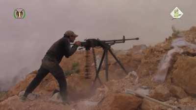 Mountain Hawk Brigade fighters take turns using a DShK to lob rounds at SAA positions - Idlib - 2016