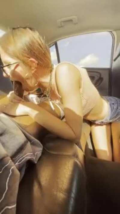 Breathtaking girl with glasses swallows a BBC in the backseat of car