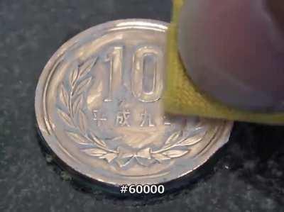 Polishing a 10 yen coin