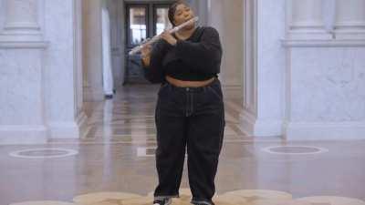 Lizzo playing a 200 year old flute in the library of congress