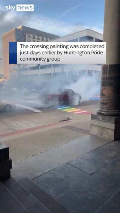 Truck driver does burnout on Pride crossing