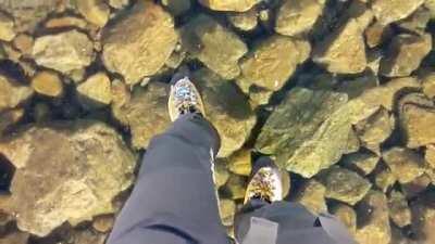 Walking on crystal clear ice in Slovakian mountains