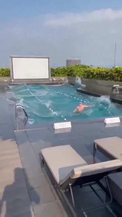 Taiwanese man swimming in his pool during the 7.4 earthquake