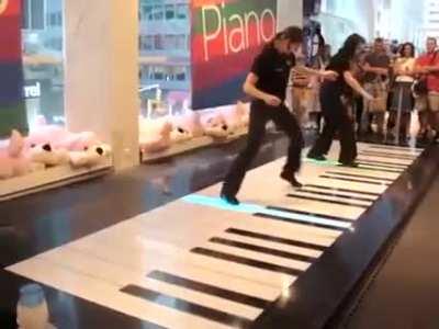 These Girls Toccatad And Fugued On A Floor Piano.