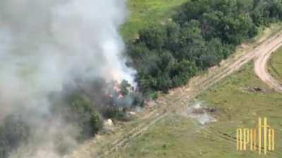 The Russian Army Msta-B howitzer and ammo stockpile are being destroyed by a specialized unit called 