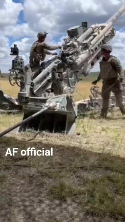 Ukrainian gunners fire their M777 155mm howitzer at Russian targets.