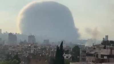 Wide shot of the explosion filmed from balcony