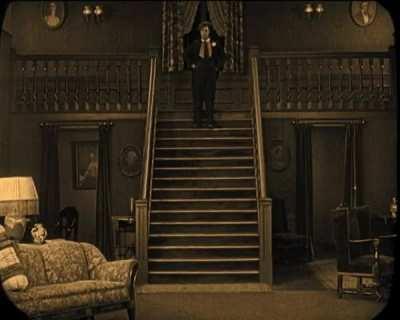 Buster Keaton running from a ghost in The Haunted House (1921)