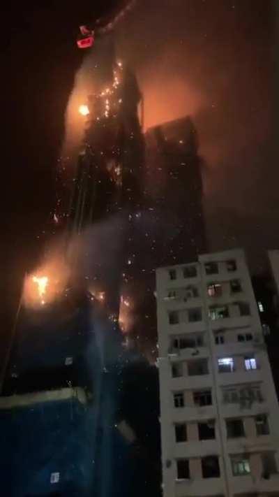 Under construction skyscraper on fire in Hong Kong