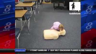 Baby doing cpr in the news