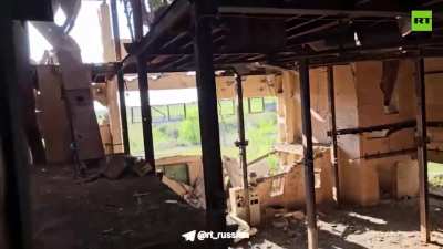 Russian RT reporter/combatant films himself hiding in a factory in Donbas when an FPV drone enters the building. The drone explodes inside the factory but fails to cause casualties. September 2024