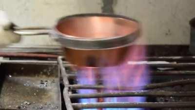 The practice of &quot;tinning&quot; copper/brass vessels. This is done to make the insides of the vessel inert.