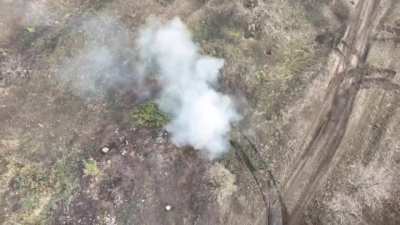 Russian drone drops a grenade into an abandoned Ukrainian M113 APC