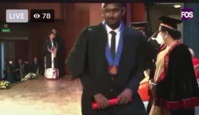 This university Chancellor getting refused by the students at the graduation ceremony.