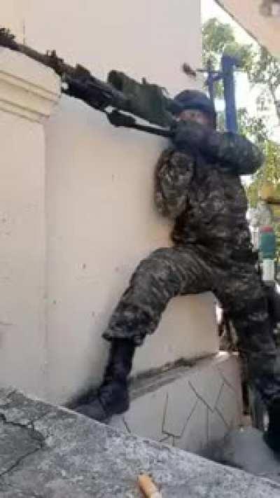 Myanmar Rebel (KNLA) sniper talking shit and laughing in the middle of a fight