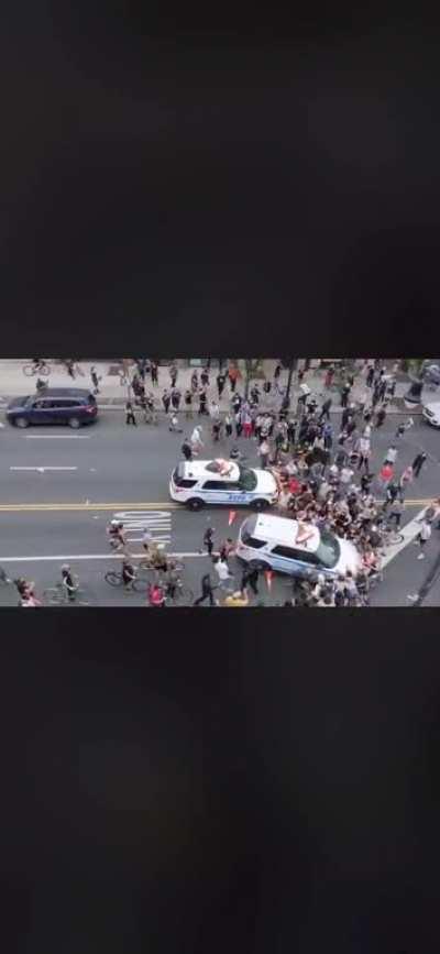 Alternate angle of NYPD cruisers ramming into protesters.