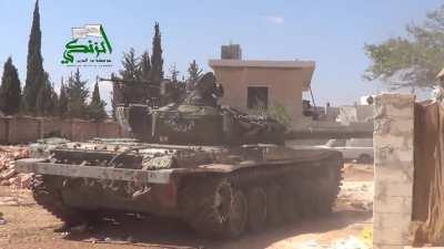 An FSA T-72 engaging IS positions with its coaxial MG is hit with return rifle fire - al-Adiya, Aleppo - 9/21/2014