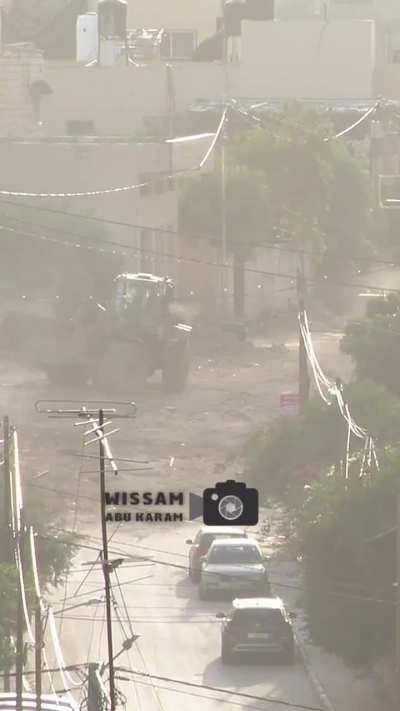 A Palestinian throw rocks on IDF D9 trying to get him move on the IED under the road and explode 