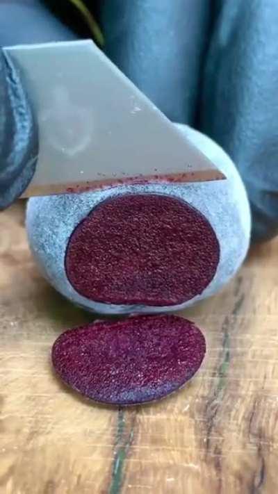 Cutting a frozen cherry.