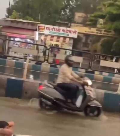 Pune Man surfs on waterlogged road after rain