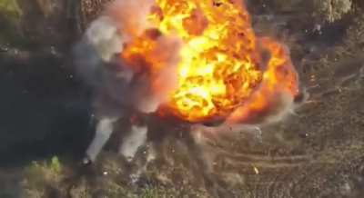 Russian armored vehicle hit by FPV explodes in massive fireball, sending soldiers flying