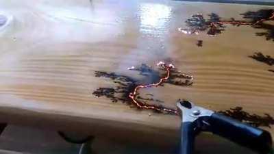 Electricity finding the path of least resistance on a piece of wood