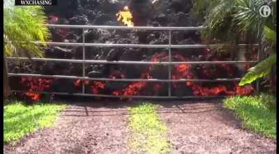 Lava engulfs Ford Mustang and smashes through gate.