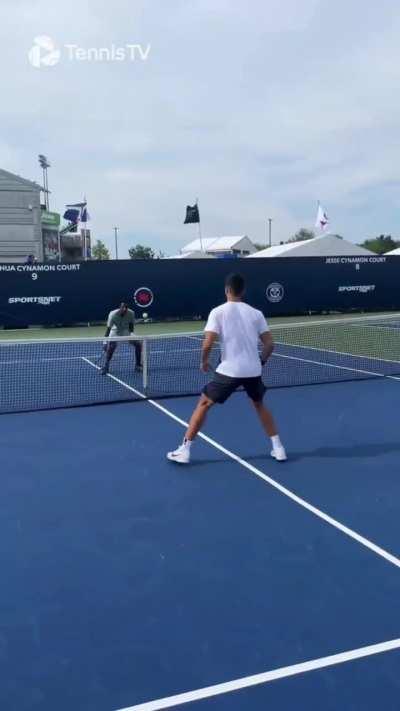 Alcaraz and Monfils having fun. And...Carlitos lost, so he had to do some push-ups.