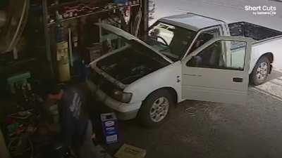 Truck driver loses control at a bend and crashes into garage 