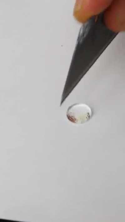 Cutting water using hydrophobic knife