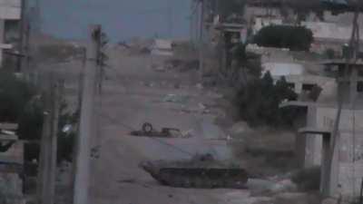 FSA camera observes a Syrian Army BMP-1 as it comes out to lay a few rounds/coax MG fire downrange - Wadi al-Deif - 6/7/2013