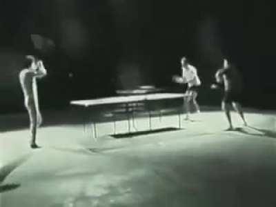 Bruce lee 2v1-ing table tennis players using nunchucks