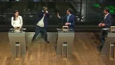 Brazilian politician strikes adversary with a chair (new angle).