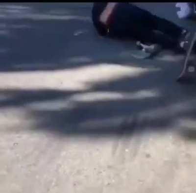 Skater does a rolling meat crayon after bombing a hill.