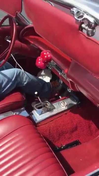 armless driver navigates his specially-modified antique car .