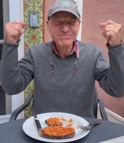 Sir Patrick Stewart enjoying his favorite dish, beans on toast.