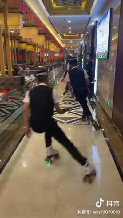 The movement of the roller skating waiters