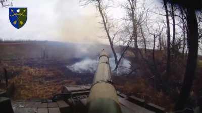 A Ukrainian tank destroys a russian assault group in a treeline near Novokalynove, Donetsk region.