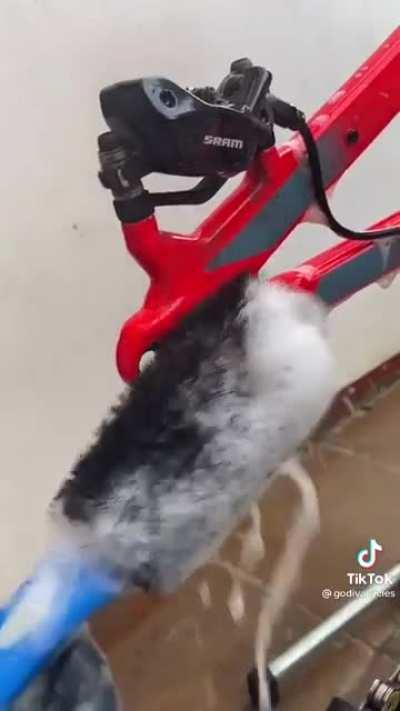 Cleaning a bike.