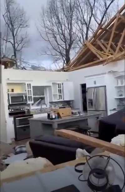 In Breman, KY man plays piano in his destroyed home. Destroyed in the storms last night spread across the south and Midwest.