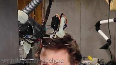 A robot that cuts hair with scissors