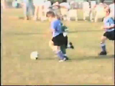 Kid getting taken out in soccer game.