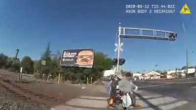 Officer saves man from oncoming train without a second to spare