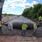 A roller screed to level concrete