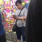 Standing Man: Hong Kong youngster standup against a man who was trying to destroy the Lennon Wall.