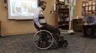 A wheelchair converting to an upright position to allow this paraplegic to move around in an upward walking position.