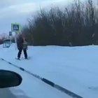 Just a man skiing with a propeller